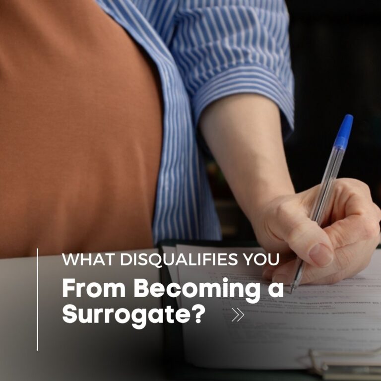 A pregnant woman with a pen in her hand filling out a form.