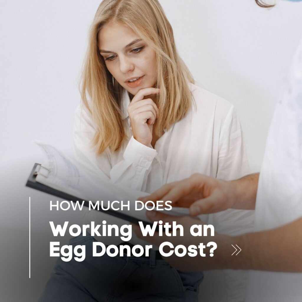A woman at a fertility clinic looking at a clipboard with egg donation costs.